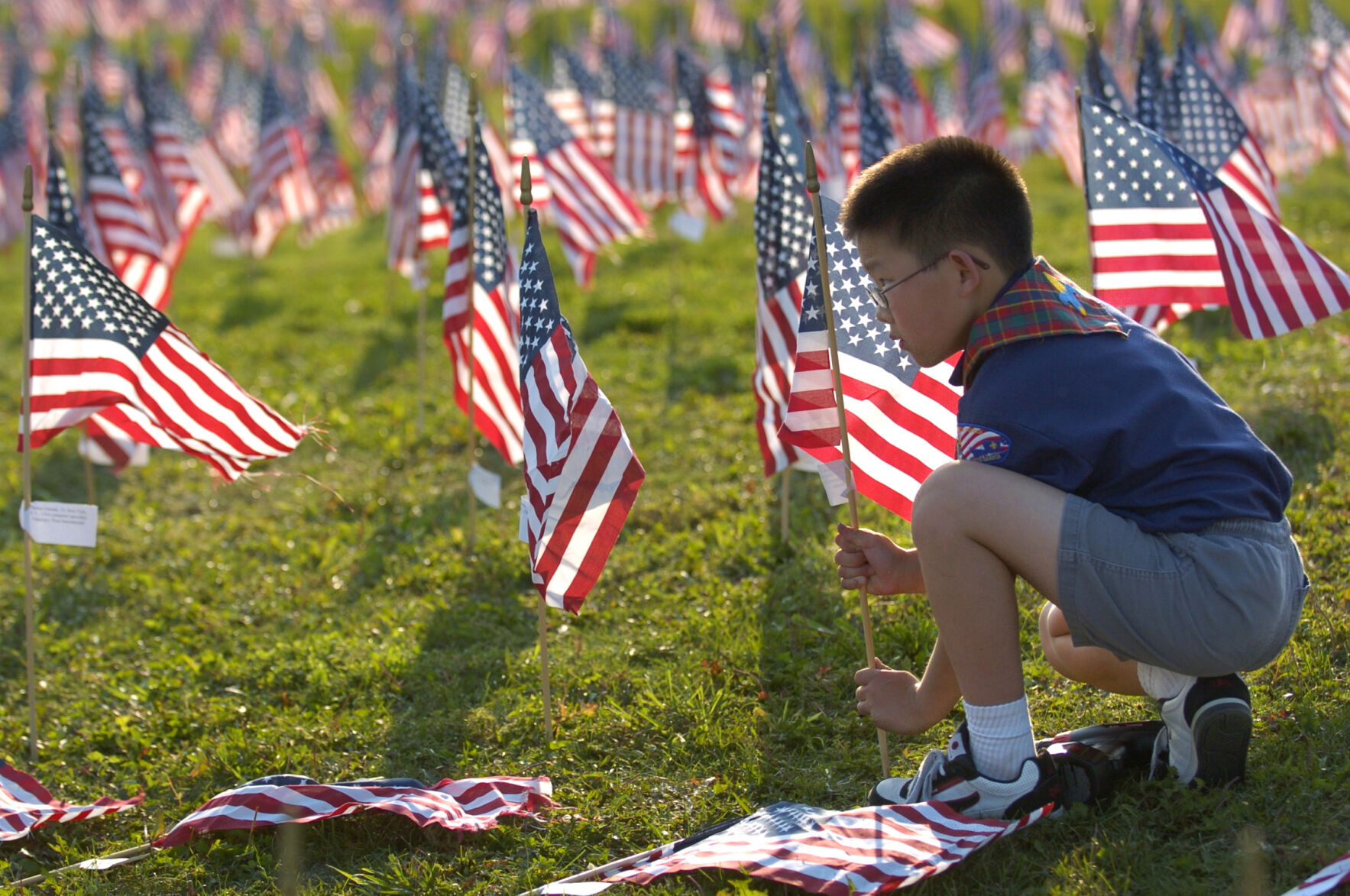 Cub Scout places American flag, 2006